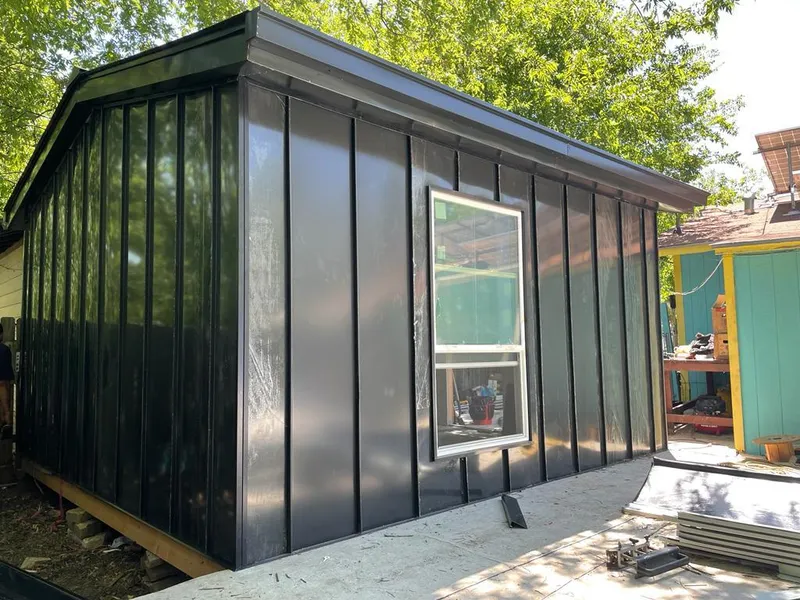 Black standing seam metal wall panels for Metal Roof Installation in Lysander