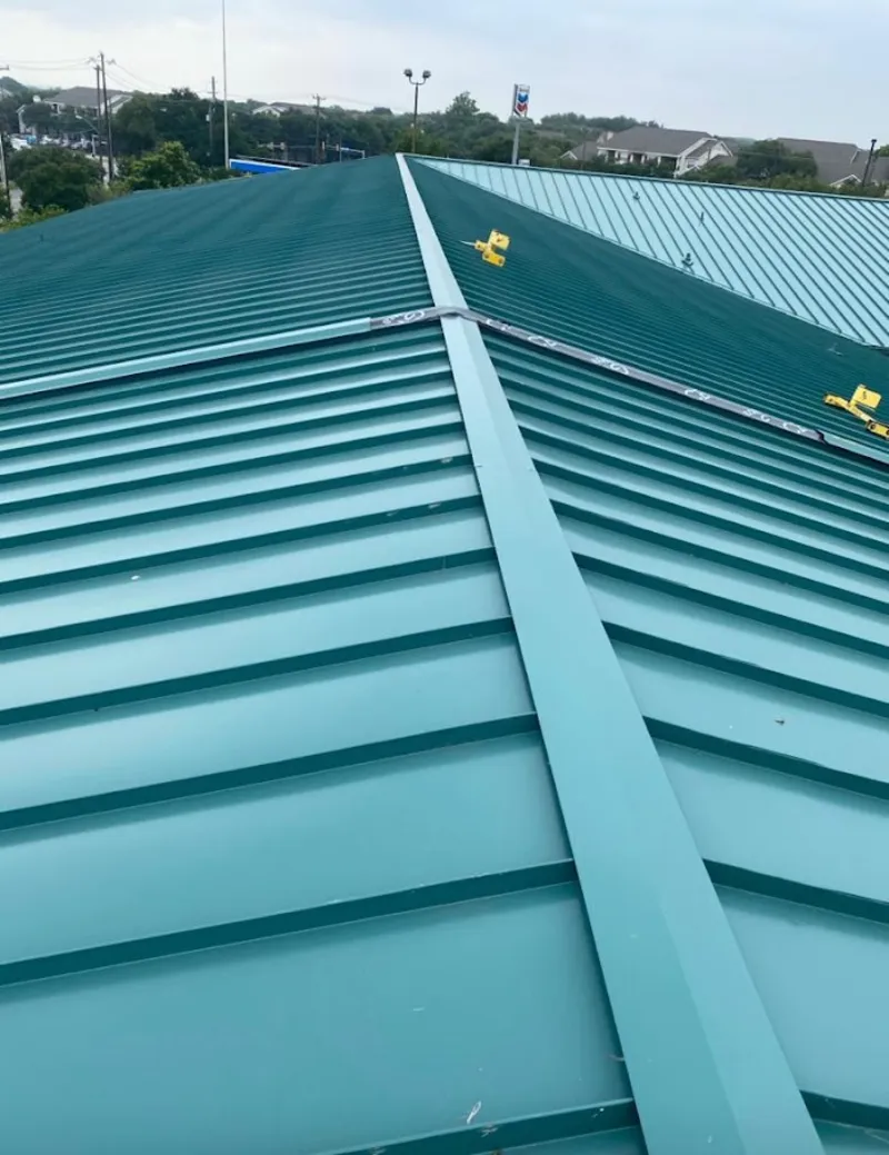 Green commercial metal roof ridge and valley for Metal Roof Repair in Lysander