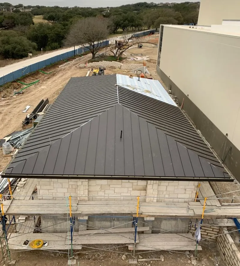 Metal roof new construction with scaffolding in Lysander